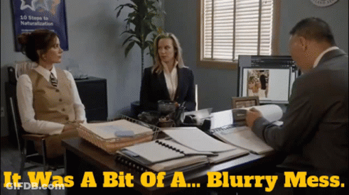 Two Women Sit At A Desk Talking To A Man With The Words It Was A Bit Of A Blurry Mess Above Them GIF