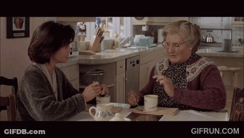 Two Women Sit At A Table With A Gifrun.com Watermark On The Bottom Right GIF