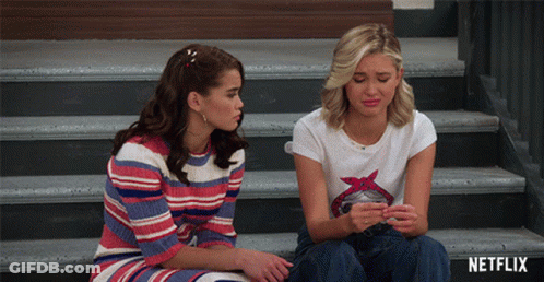 Women Sitting On Stairs With Netflix Logo GIF