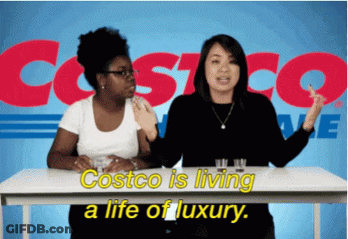 Two Women Sitting At A Table With Costco Written In The Background GIF