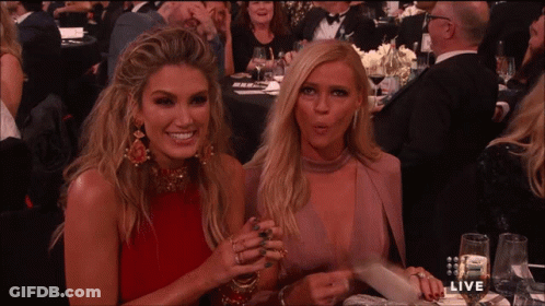 Two Women Sitting At Live Sign GIF