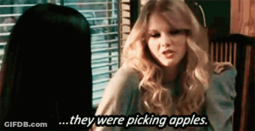 Two Women Sitting At Table One Says Picking Apples GIF
