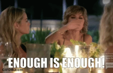 Two Women Sitting At Table Saying Enough Is Enough GIF