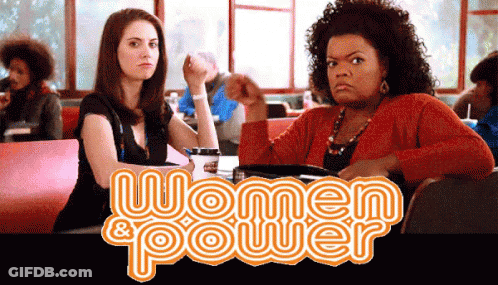 Two Women Sitting At Table Saying Women & Power GIF