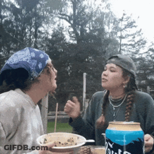 Two Women Sitting At Table With Pabst Beer GIF