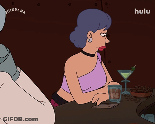 Two Women Sitting At Table With Who Me GIF