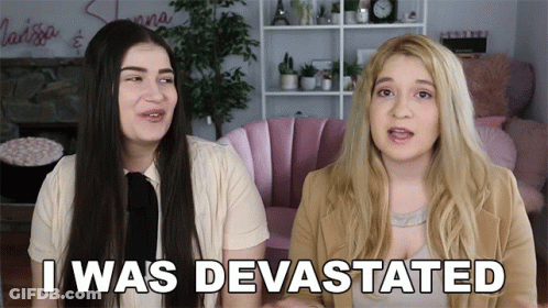 Two Women Sitting Devastated GIF