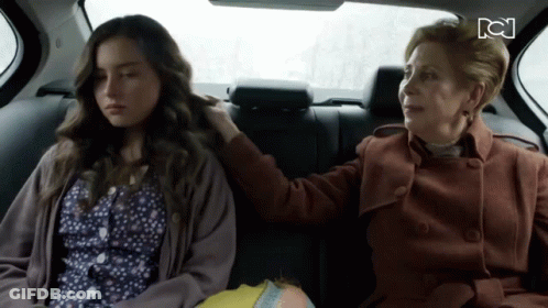 Two Women Sitting In Back Seat Of Car With CN Logo GIF