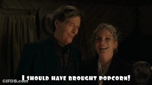 Two Women Sitting In Car With Letter D GIF