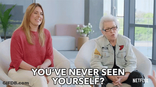 Two Women Sitting In Chairs One Asking If She Has Never Seen Herself GIF