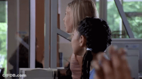Two Women Sitting In Front Of Computer GIF