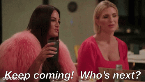 Two Women Sitting Keep Coming Who's Next GIF