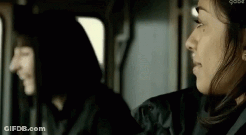 Two Women Sitting Next To Each Other In Car GIF