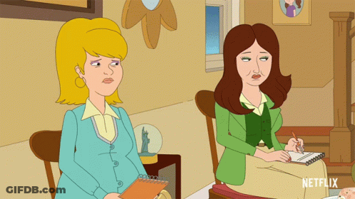 Two Women Sitting Next To Each Other GIF