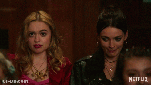 Two Women Sitting Next To Each Other With A Netflix Logo On The Bottom Right GIF