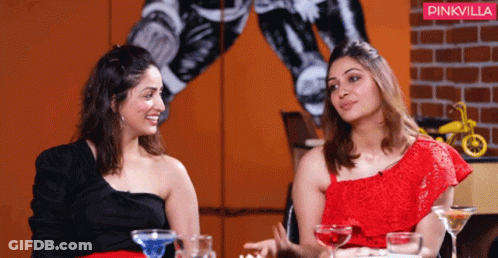 Two Women Sitting Next To Each Other With A Pinkvilla Logo In The Background GIF