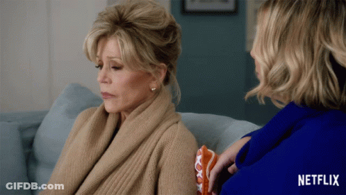 Two Women Sitting On A Couch With A Netflix Logo On The Bottom GIF