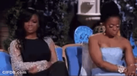Two Women Sitting On Couch GIF