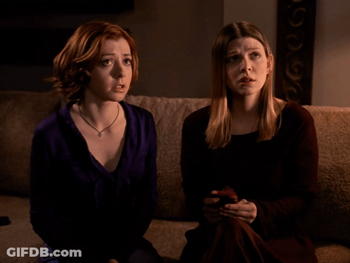 Two Women Sitting On Couch One Says Oh GIF