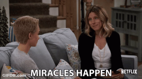 Two Women Sitting On Couch Saying Miracles Happen GIF