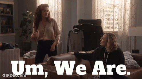 Two Women Sitting On Couch Saying Um We Are GIF