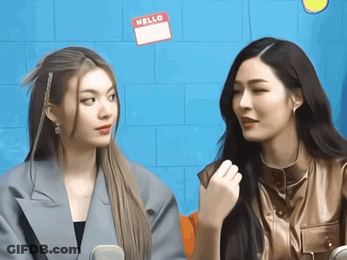 Two Women Sitting With Hello Name Tags GIF