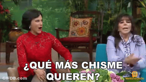 Two Women Sitting With Que Mas Chisme Quieren GIF