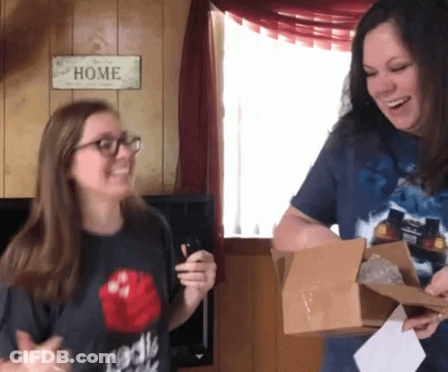 Two Women Smiling At Home Sign GIF