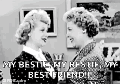 Two Women Standing Beside Each Other In Living Room GIF