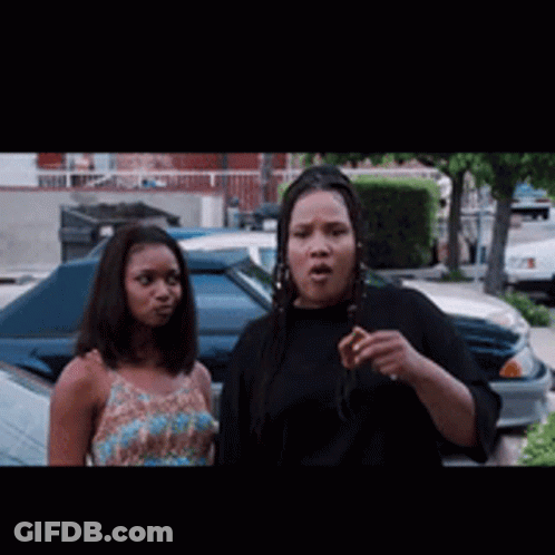 Two Women Standing By Car In Parking Lot GIF
