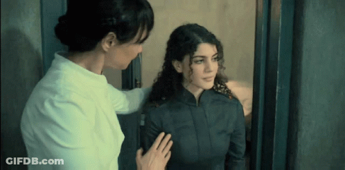 Two Women Standing In Doorway GIF