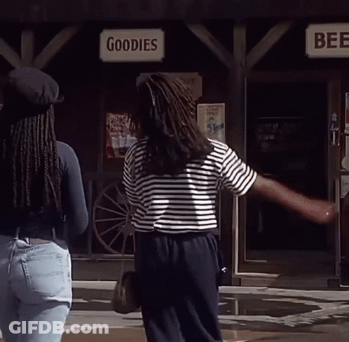 Two Women Standing In Front Of A Store Called Goodies And Beer GIF