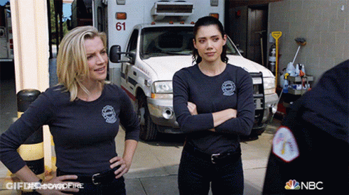 Two Women Standing In Front Of Ambulance 61 GIF
