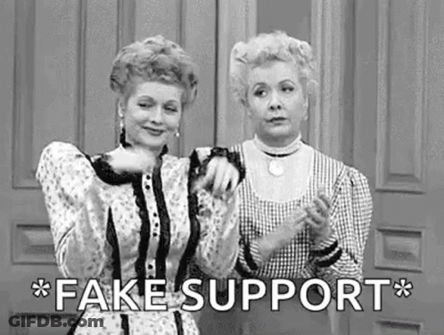 Two Women Standing In Front Of Door Saying Fake Support GIF