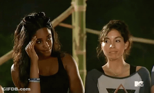 Two Women Standing In Front Of MTV Screen GIF