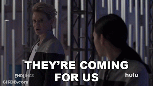 Two Women Standing Next To Each Other GIF