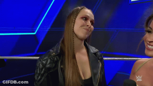 Two Women Standing Next To Each Other GIF