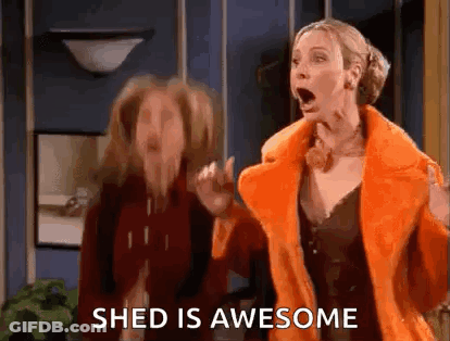 Two Women Standing Next To Each Other One In Orange Coat GIF