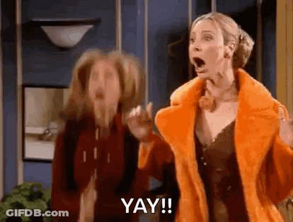 Two Women Standing Next To Each Other GIF
