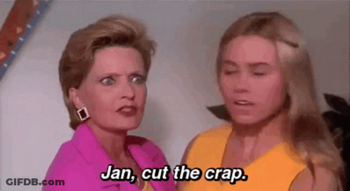 Two Women Standing Next To Each Other Talking GIF