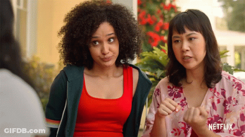 Two Women Standing Next To Each Other With A Netflix Logo On The Bottom Right GIF