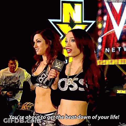 Two Women Standing Next To Each Other With One Saying You 'Re About To Get The Beat Down Of Your Life .. GIF