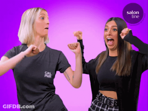 Two Women Standing, One With Girl Pwr Shirt GIF