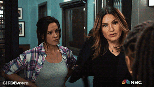 Two Women Standing Next To Each Other With The Nbc Logo On The Bottom Right GIF