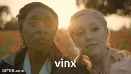 Two Women Standing Next To Each Other With The Word Vinx On The Bottom Right GIF
