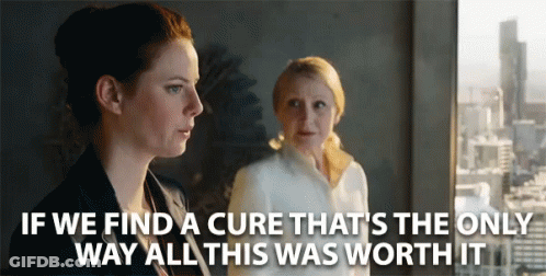 Two Women Standing Next To Each Other With The Words If We Find A Cure GIF