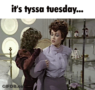 Two Women Standing Next To Each Other With The Words " It 'S Tyssa Tuesday " Above Them GIF