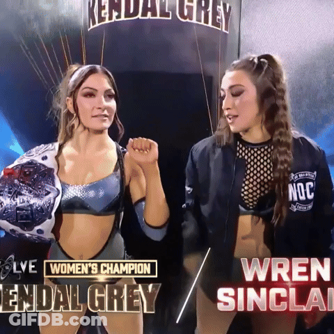 Two Women Standing Next To Each Other With The Words Women 'S Champion Kendal Grey And Wren Sinclair Below Them GIF