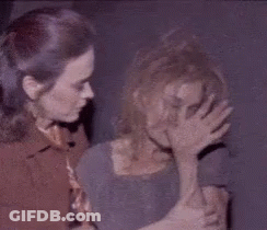 Two Women Standing One Covering Face With Hand GIF
