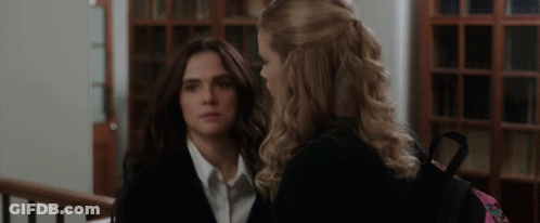 Two Women Standing One With Backpack GIF